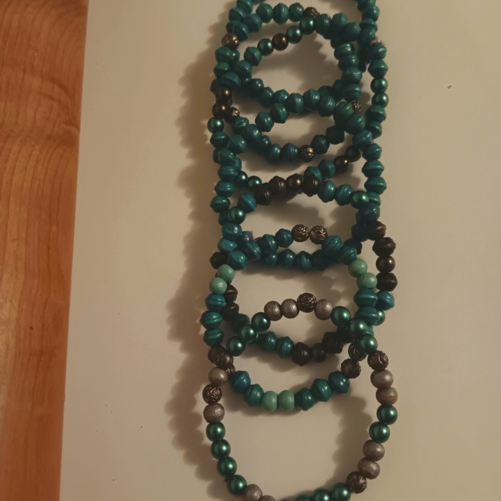Teal and silver beaded strands with a Festival vibe.